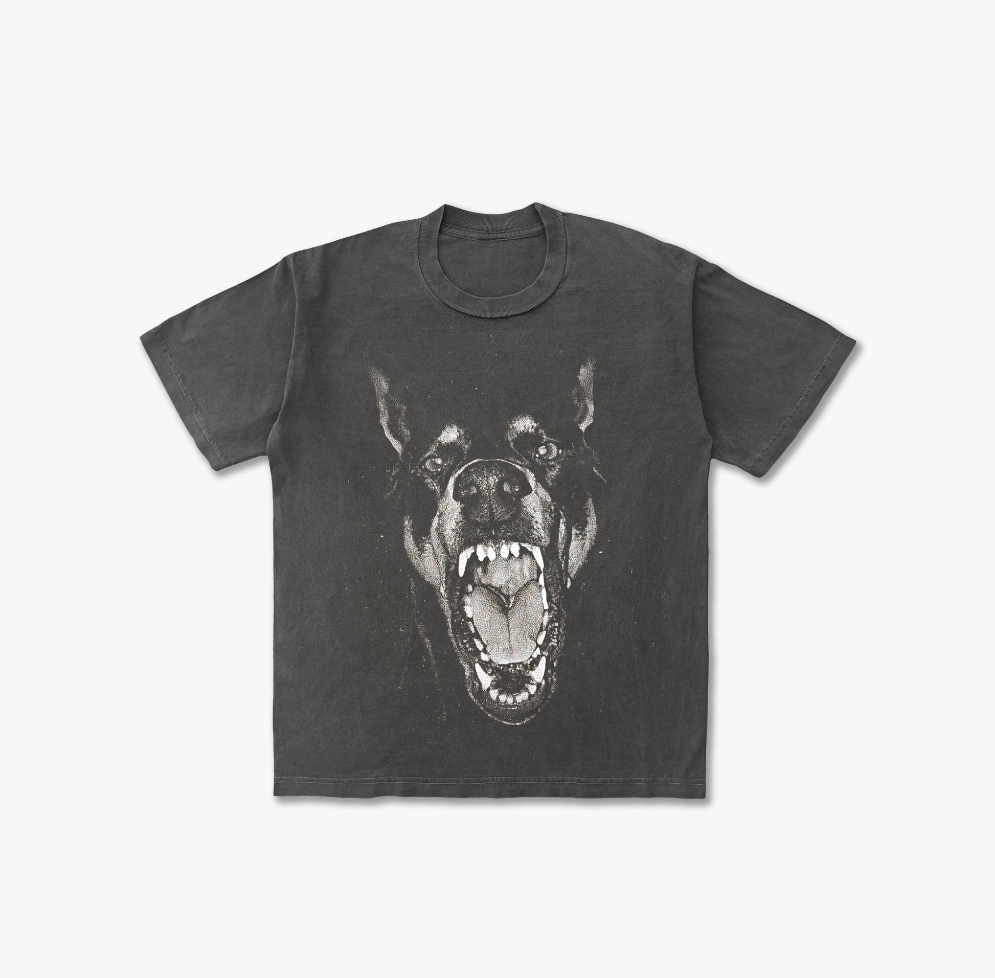 T-shirt featuring a large, high-contrast graphic print of a Doberman Pinscher's head with its mouth wide open, snarling and showing teeth, in a black and white or grayscale effect.